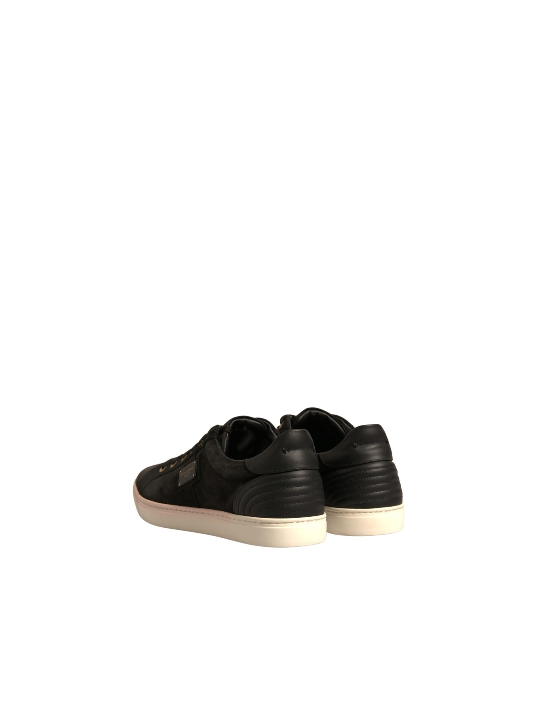 Pair of black sneakers with white soles
