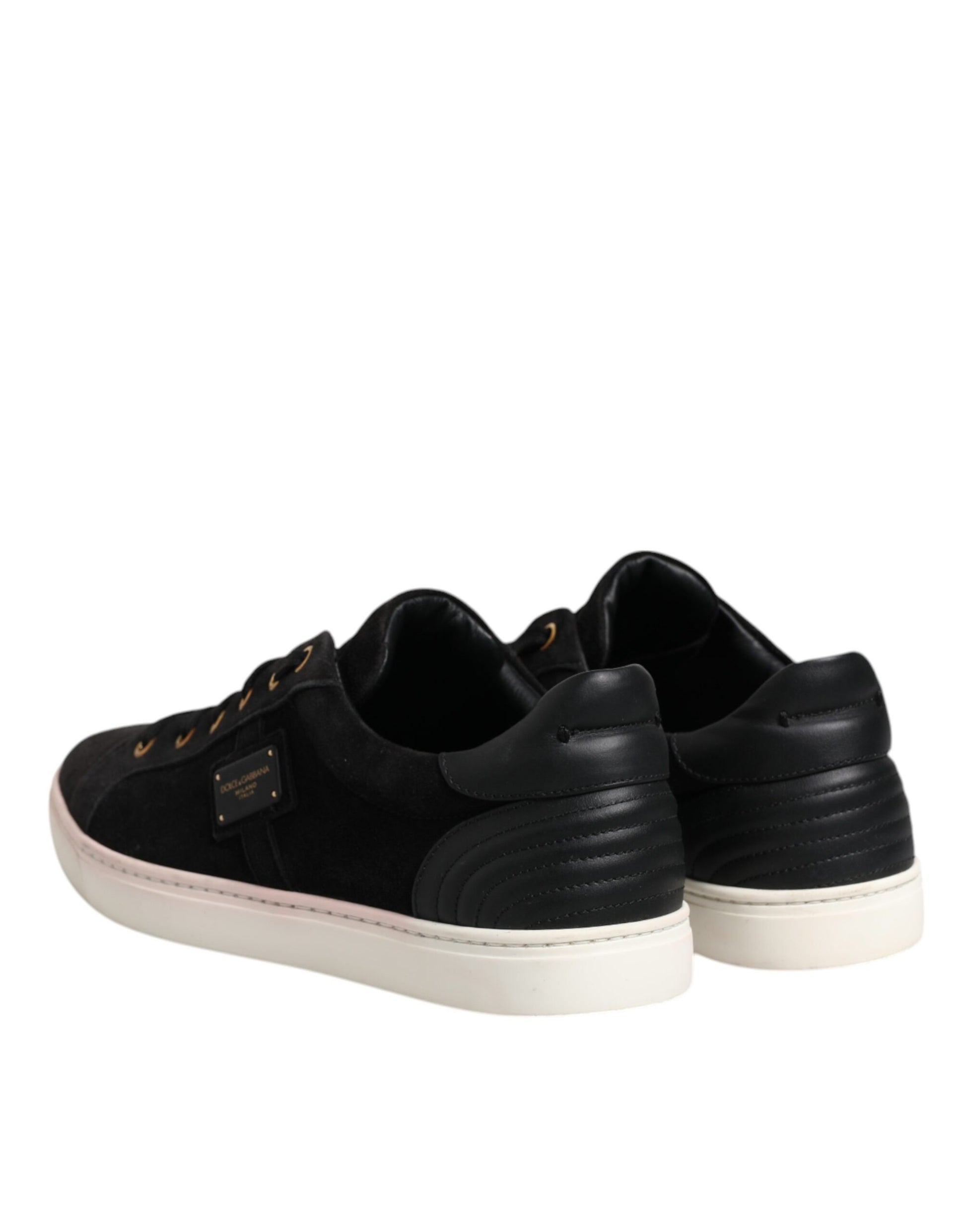 Pair of black sneakers with white soles