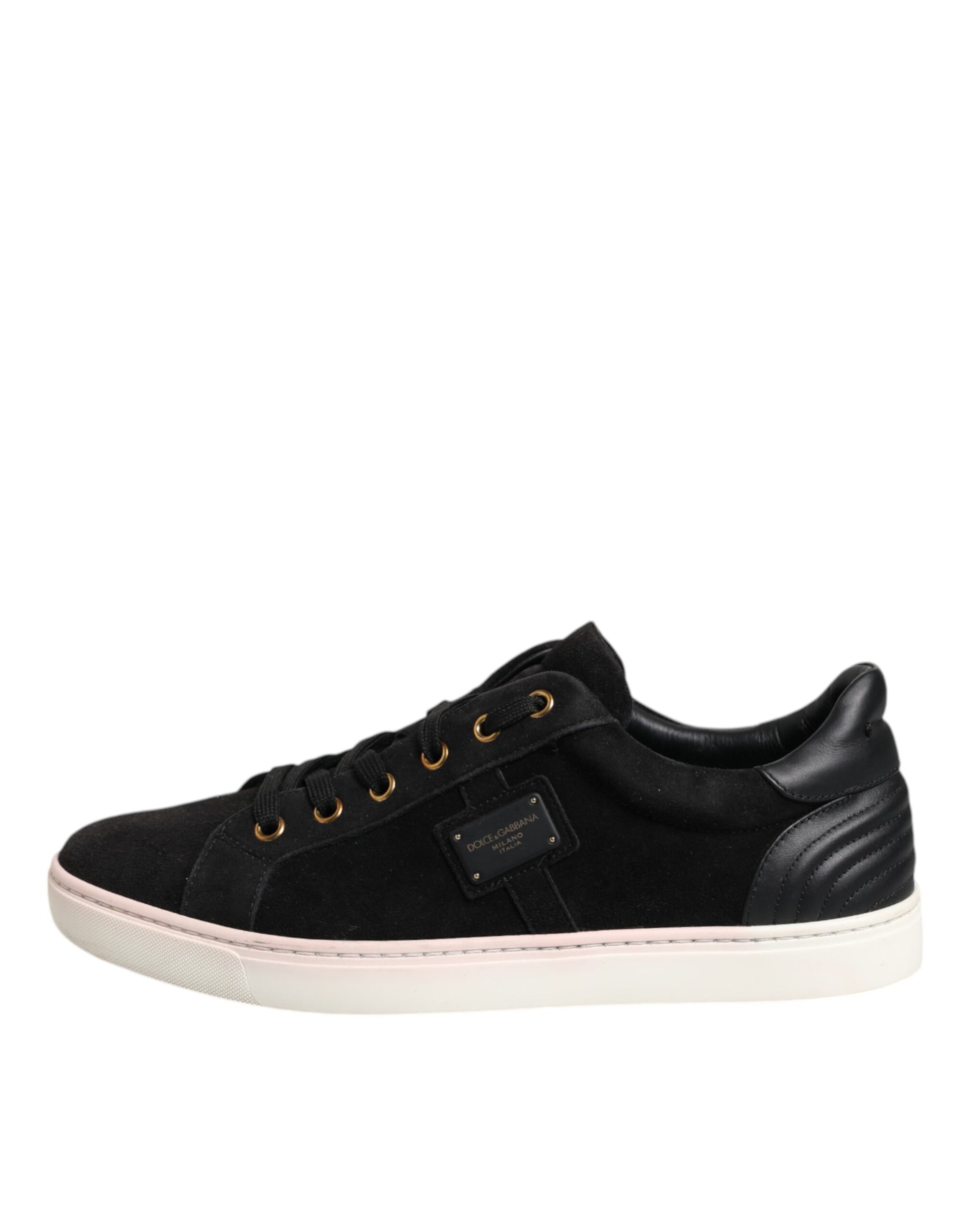 Black sneaker with gold laces and a pink sole