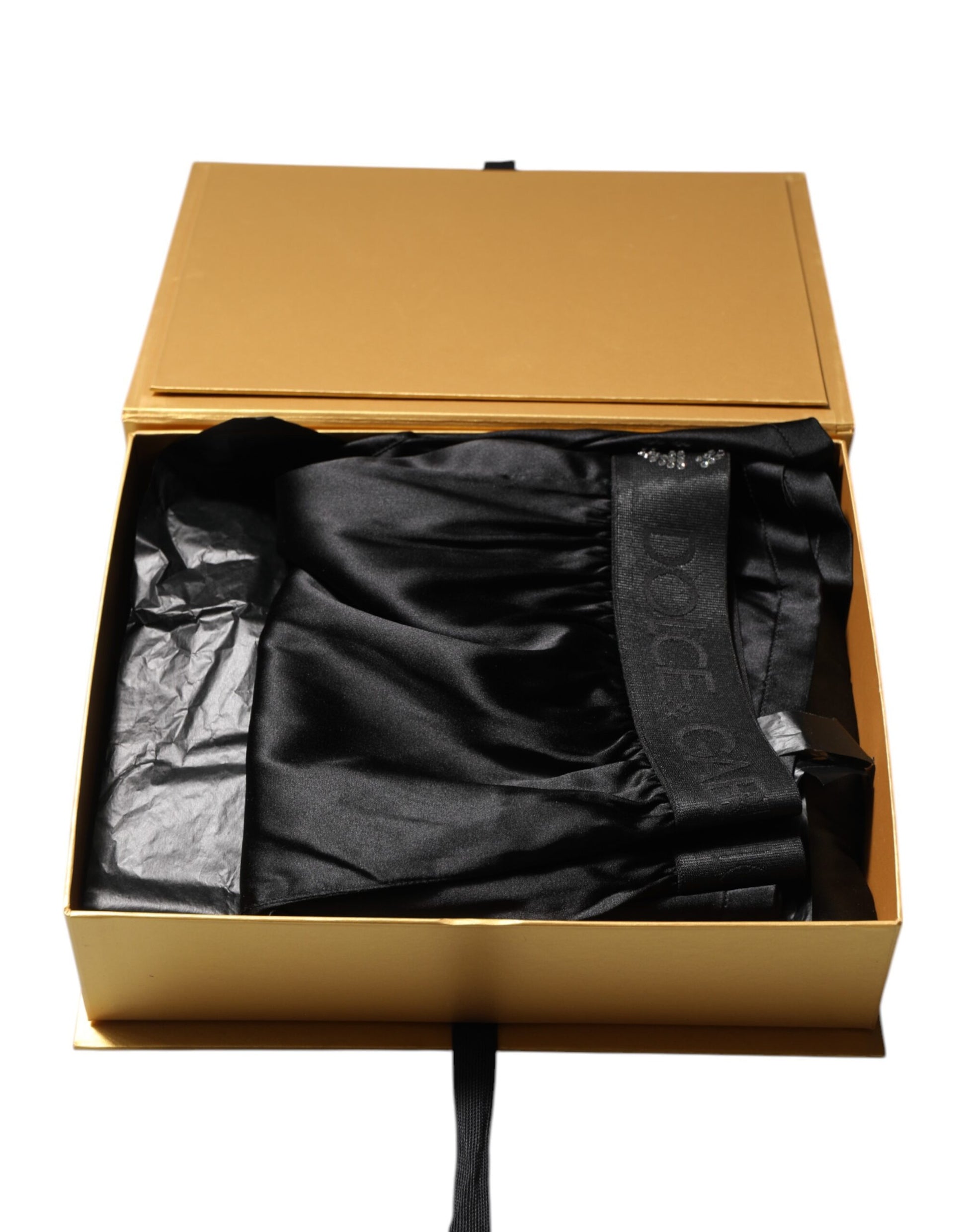 Box containing a black tie and matching fabric