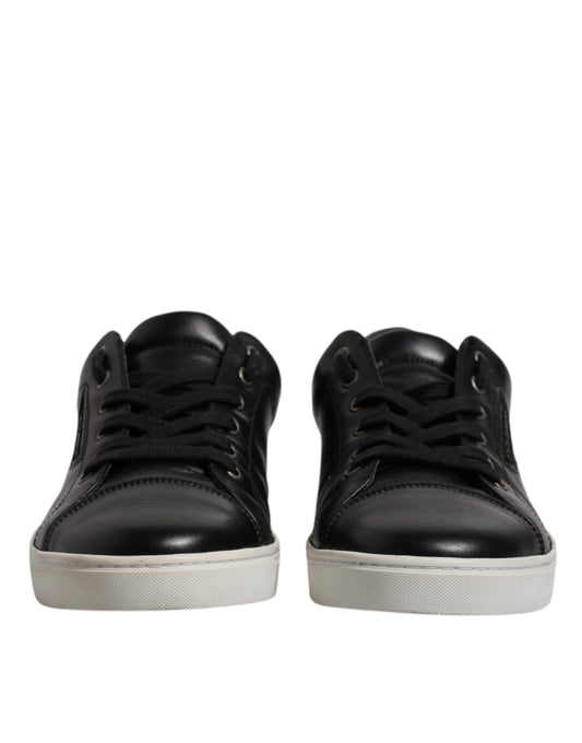 Pair of black leather boots with white soles