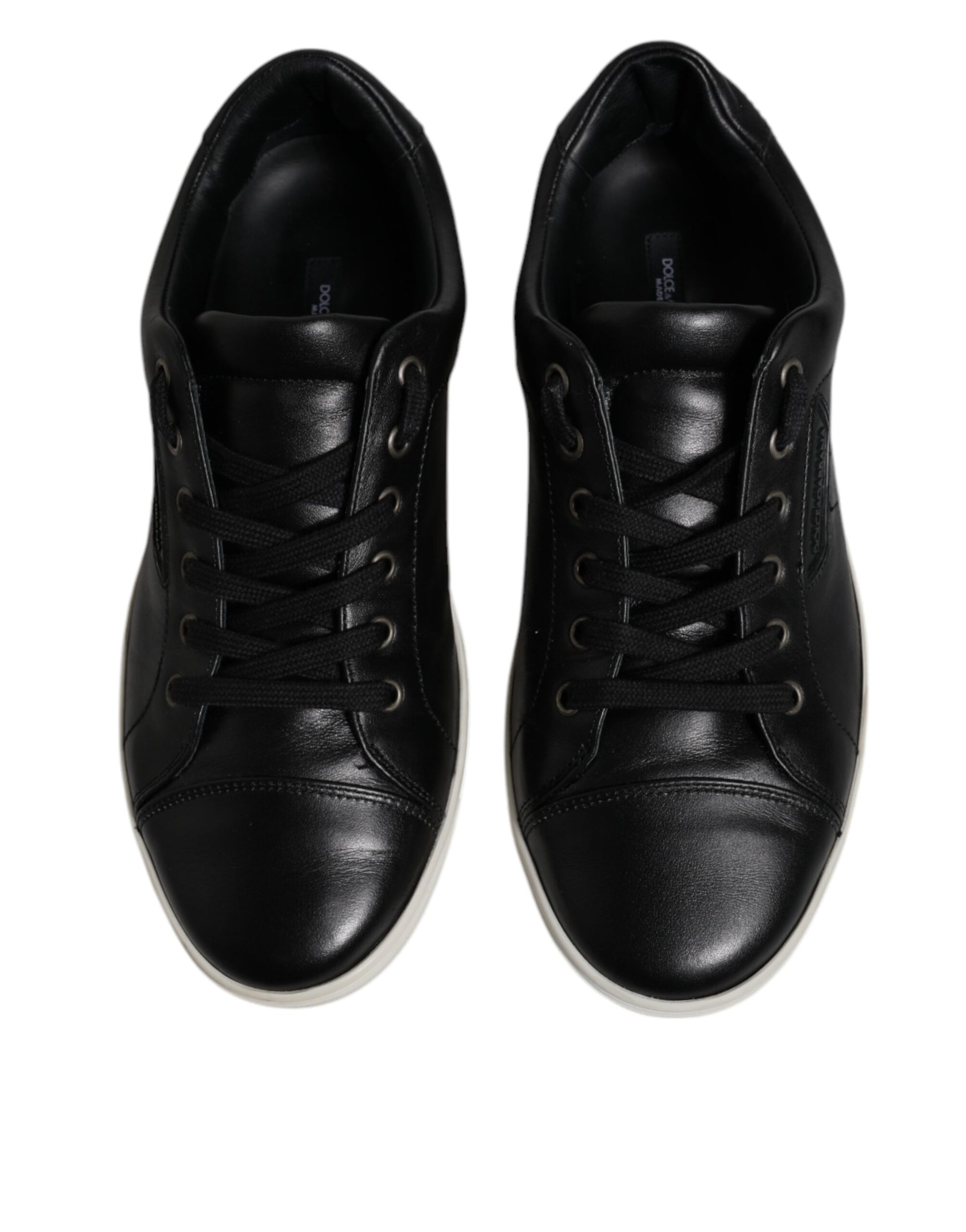 Pair of black sneakers with white soles