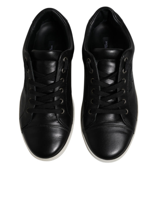 Pair of black sneakers with white soles
