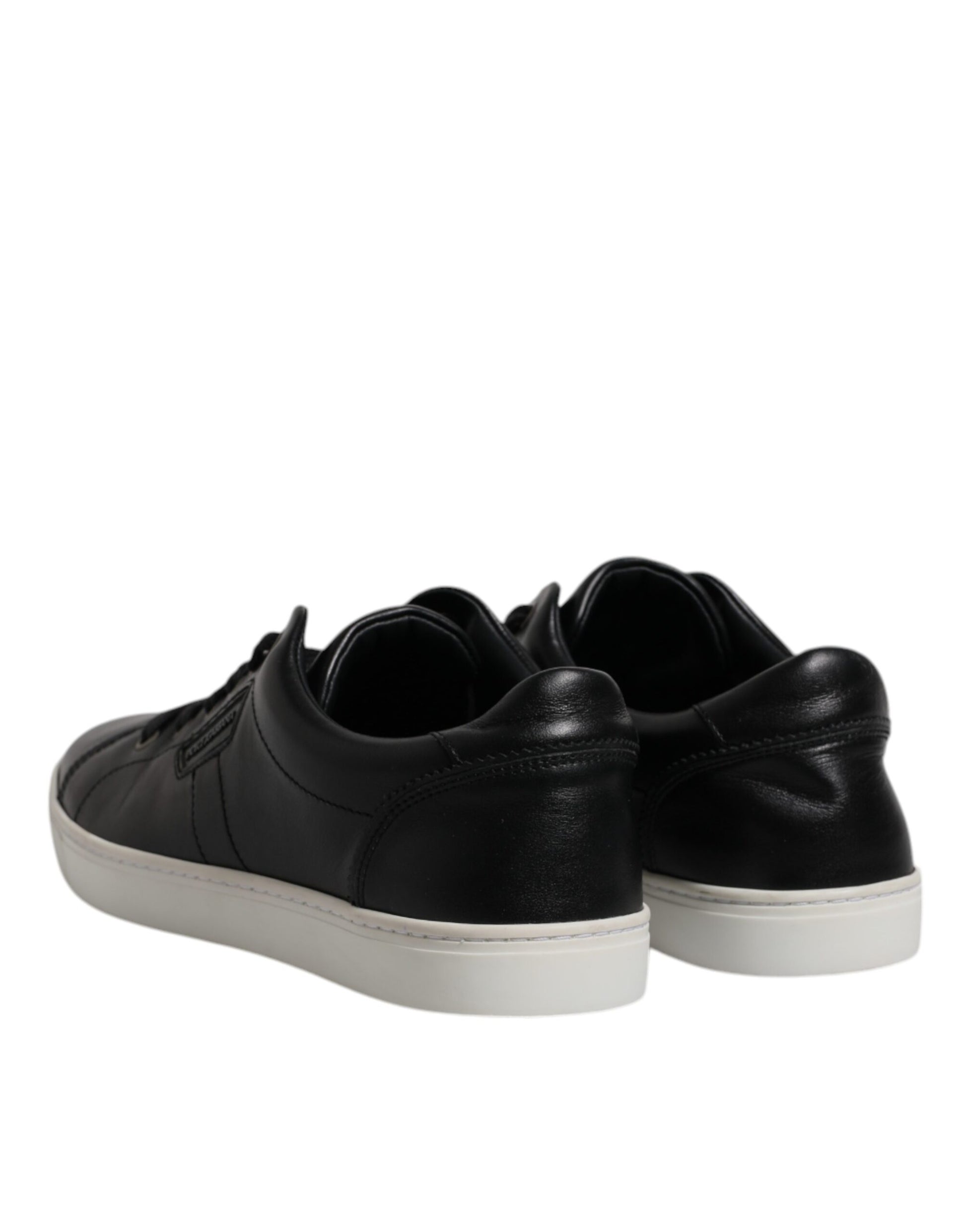 Pair of black sneakers with white soles