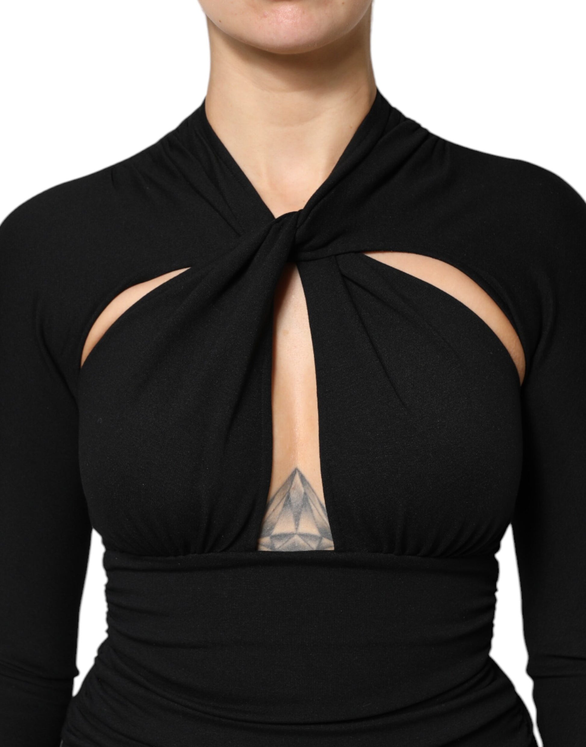 A black midi dress with a tie at the neck and a sheer panel on the chest