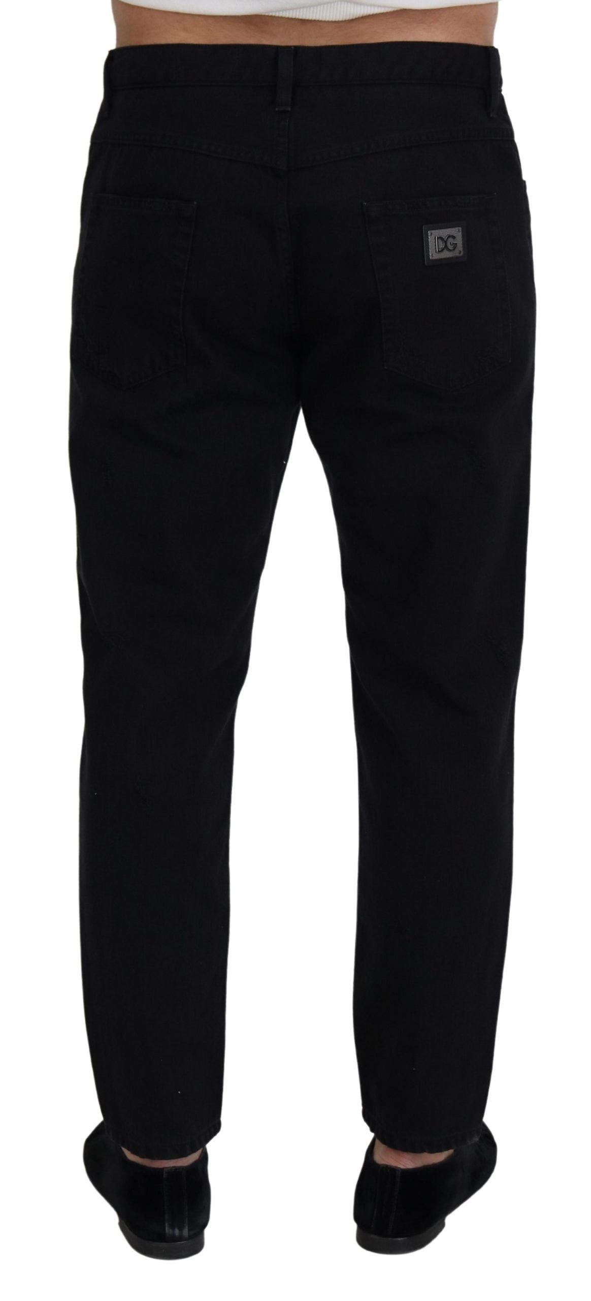 Pair of black pants with a white label on waistband