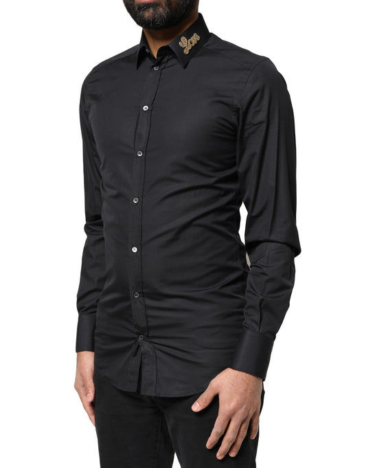 A black formal dress shirt with embroidered gold love design on the chest