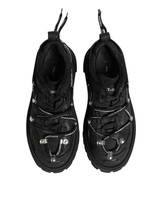 Pair of black hiking shoes with laces and straps
