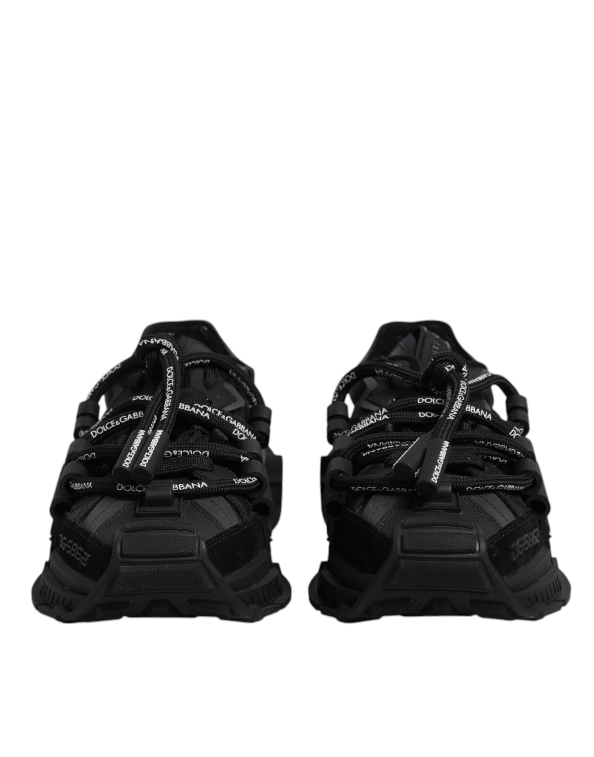 Pair of black athletic shoes with white laces