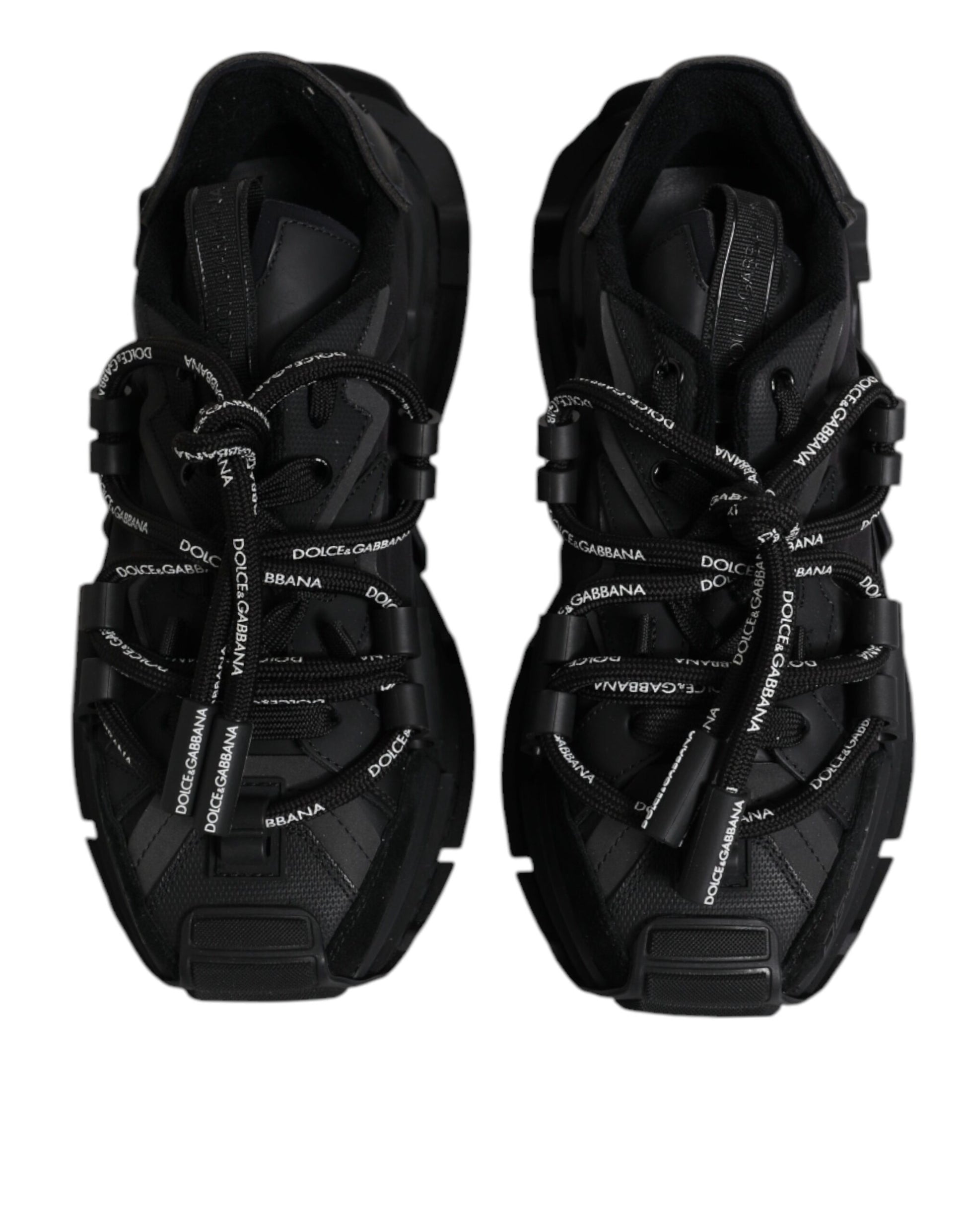 Pair of black athletic shoes with white laces