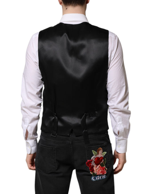 A black lurex vest with a floral embroidery on the back