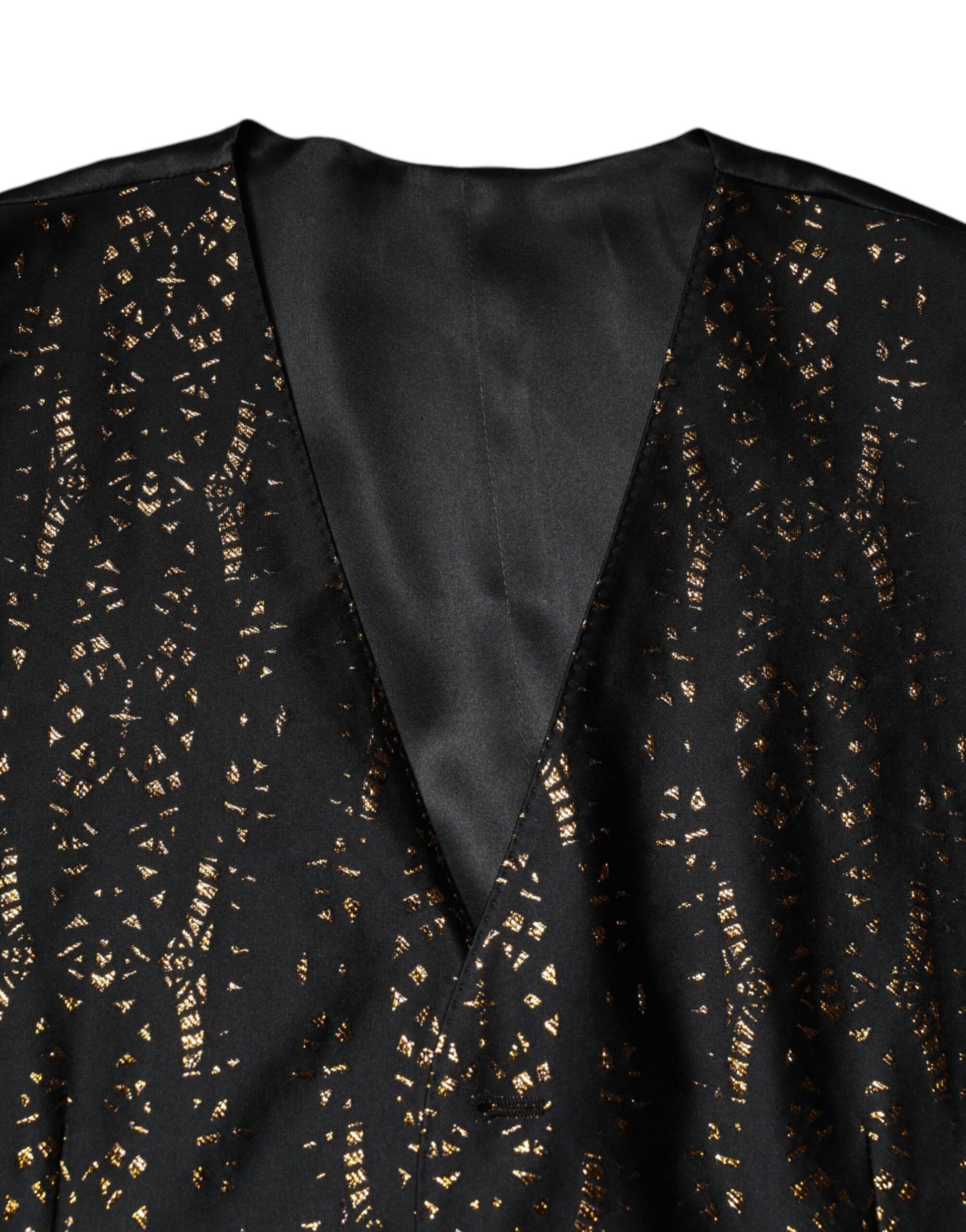 A black lurex vest with gold sequins, part of a formal men's suit