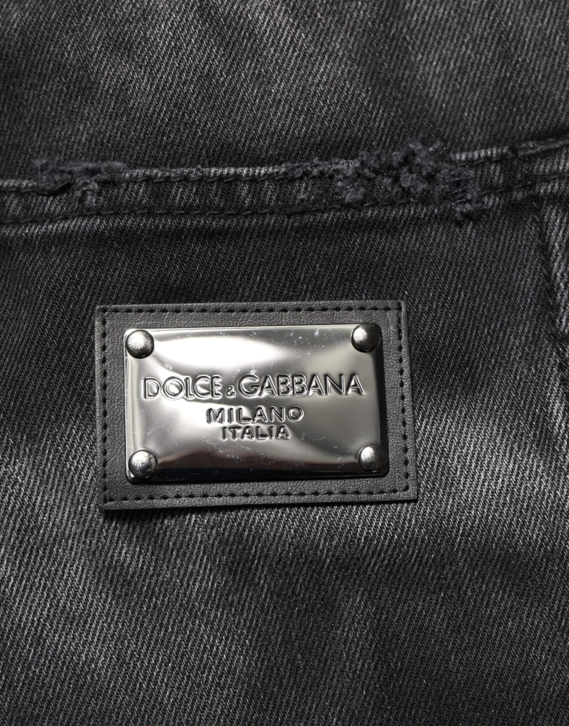 Silver logo on black fabric