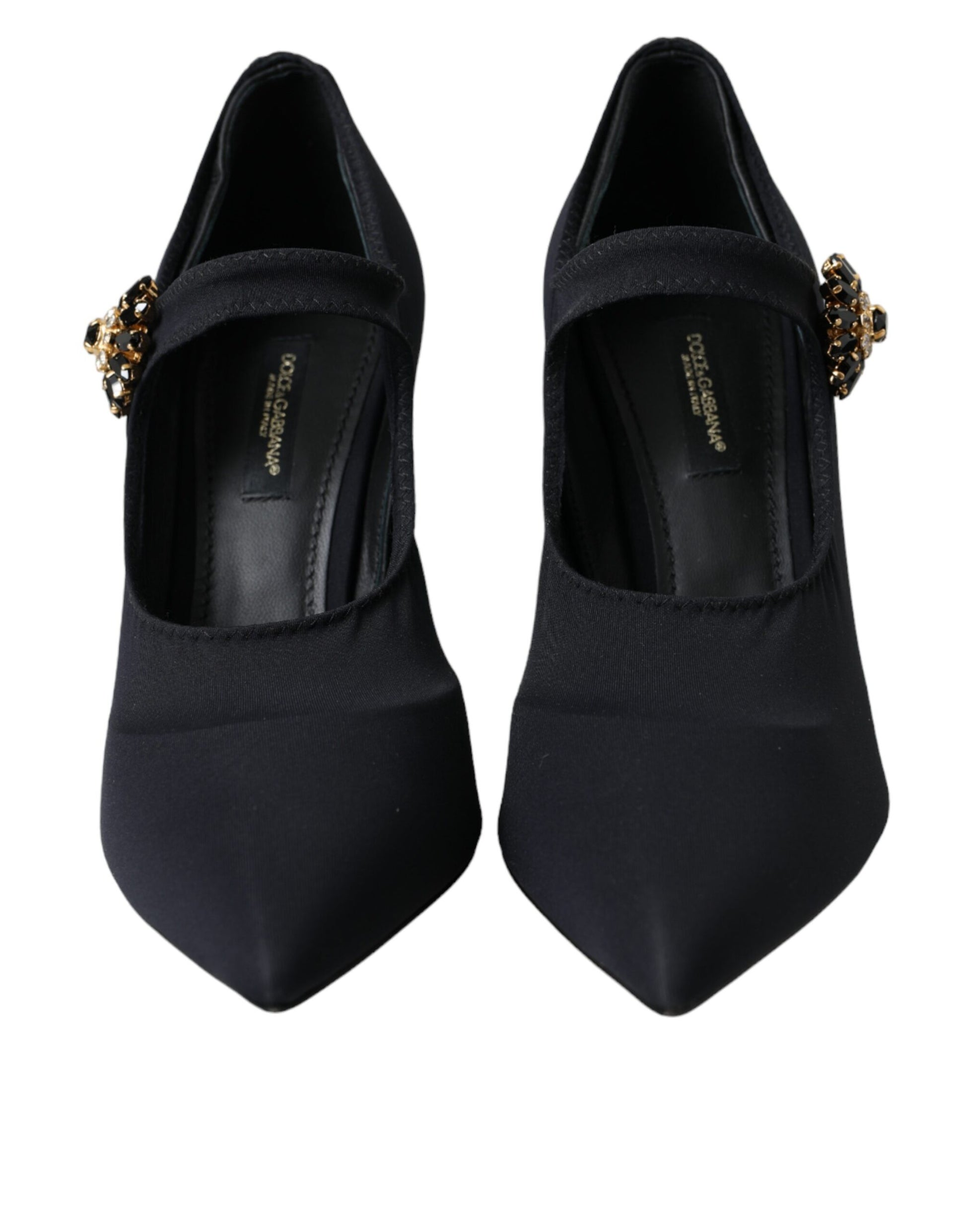 Pair of black high heel shoes with gold accents