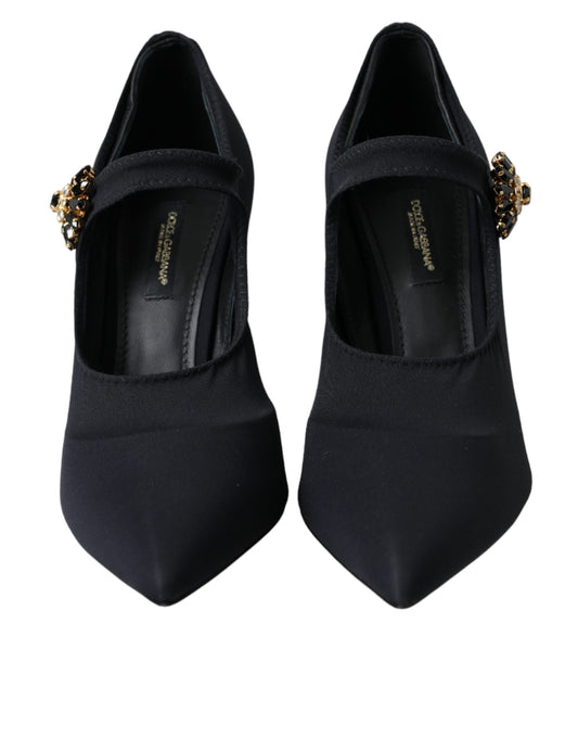 Pair of black high heel shoes with gold accents