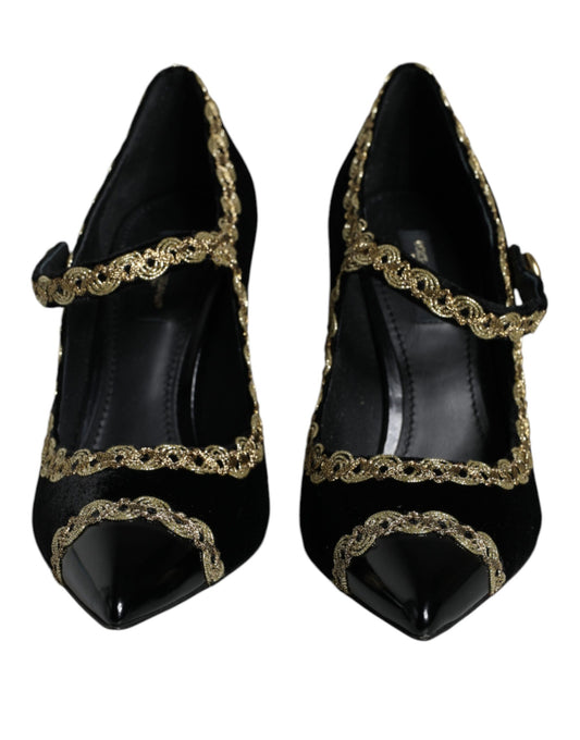 Pair of black shoes with gold accents