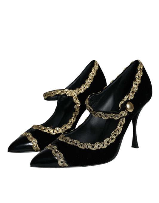 Pair of black high heel shoes with gold accents