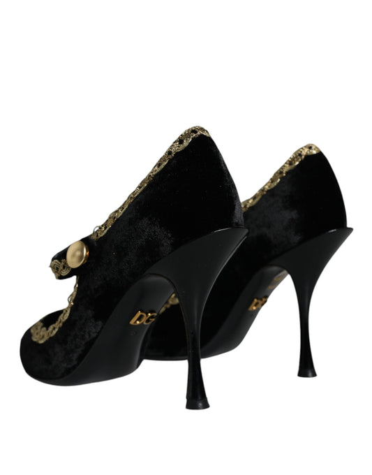 Pair of black velvet high heel shoes with gold accents