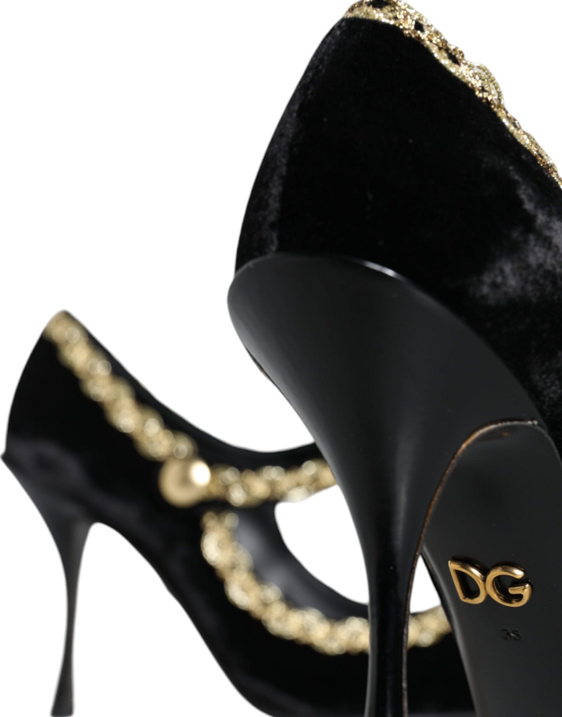 Black high heel shoes with gold accents