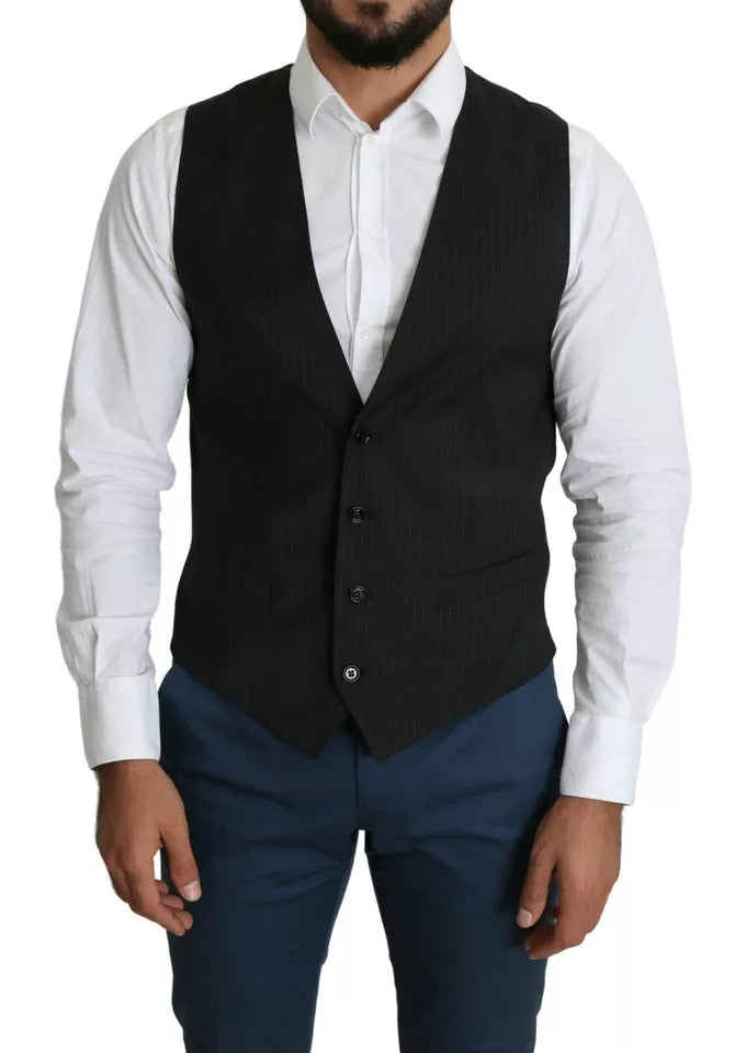 A black vest with a lapel and buttons, part of a formal staff dress