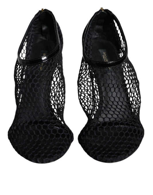 Pair of black high heel shoes with lace detailing