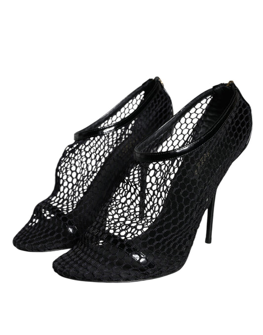 Pair of black high heel shoes with lace detailing