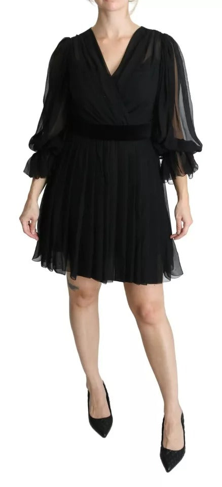 A black mesh pleated mini dress with a silk blend fabric