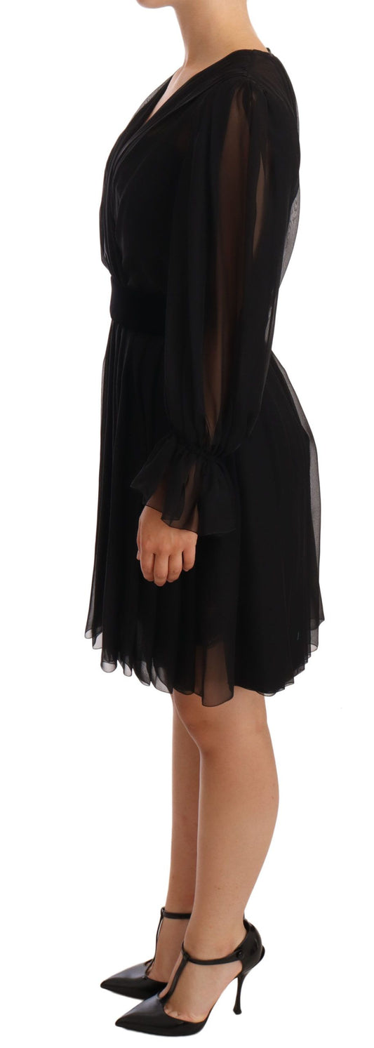 A black mesh pleated mini silk stretch dress with a high neckline and long sleeves