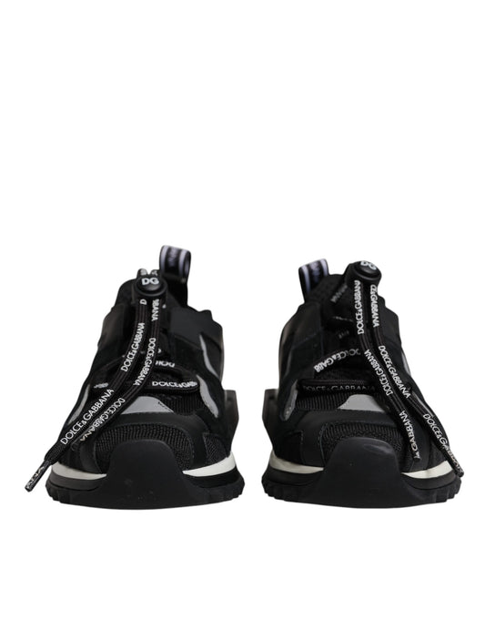 Pair of black sneakers with white laces and a zipper on top