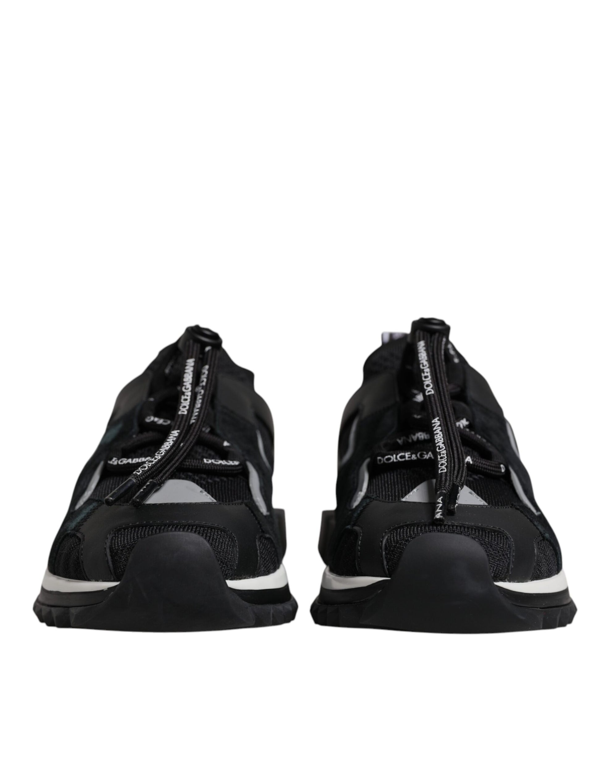 Pair of black athletic shoes with white laces