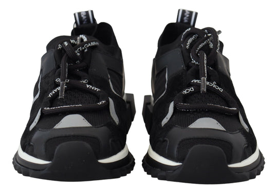 Pair of black and white sneakers with laces tied in a bow