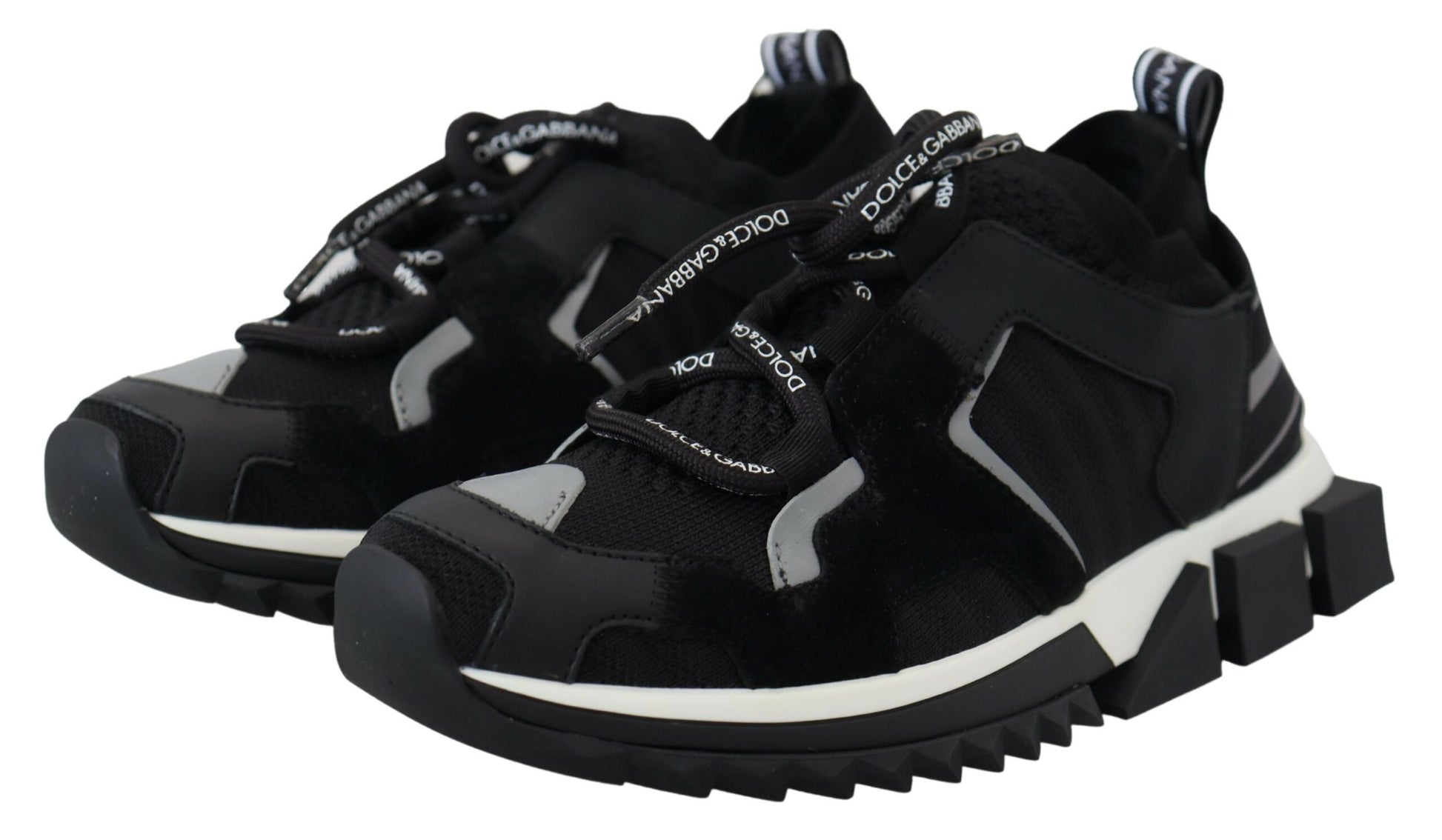 Pair of black and white sneakers with laces