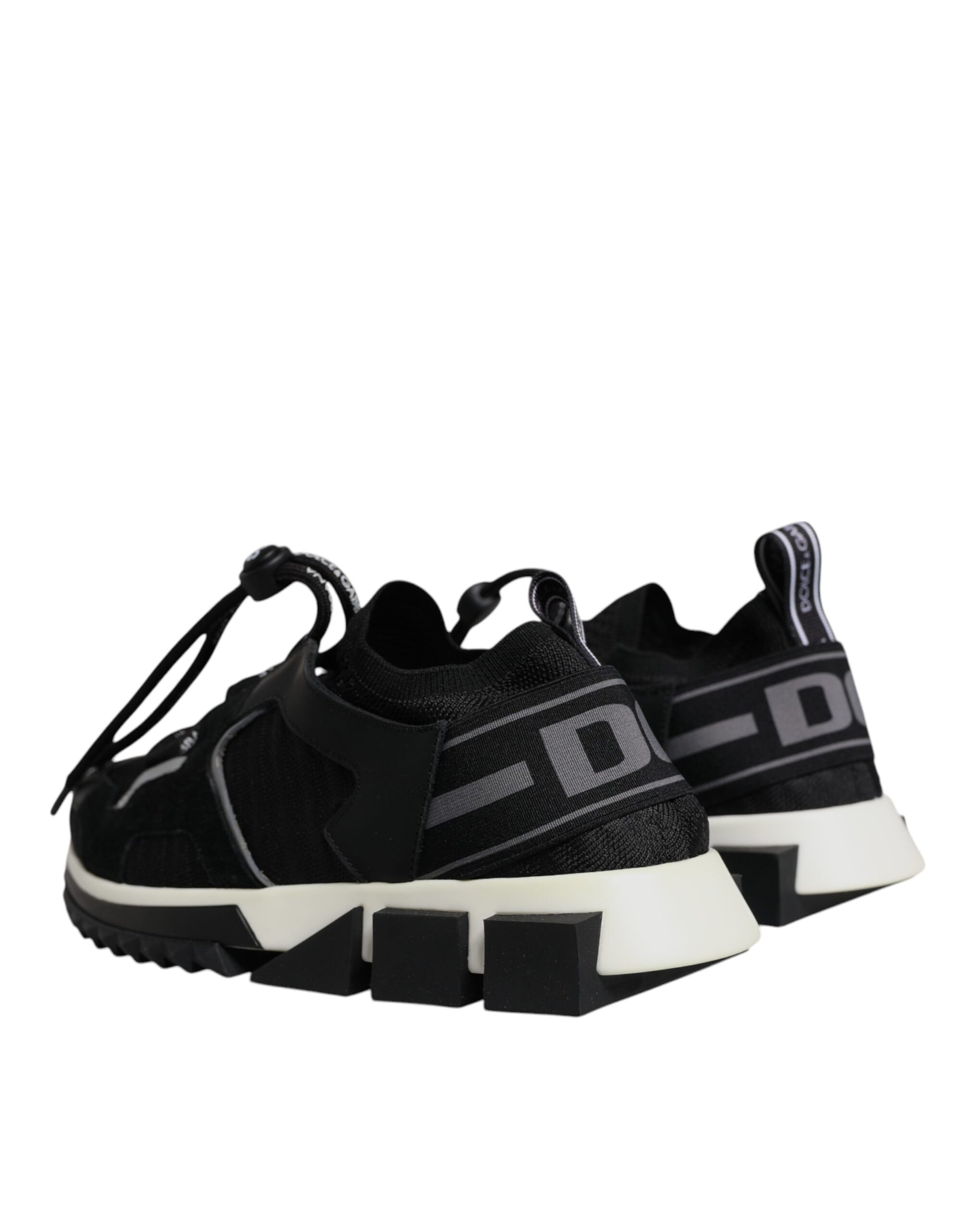 Pair of black and white sneakers with laces