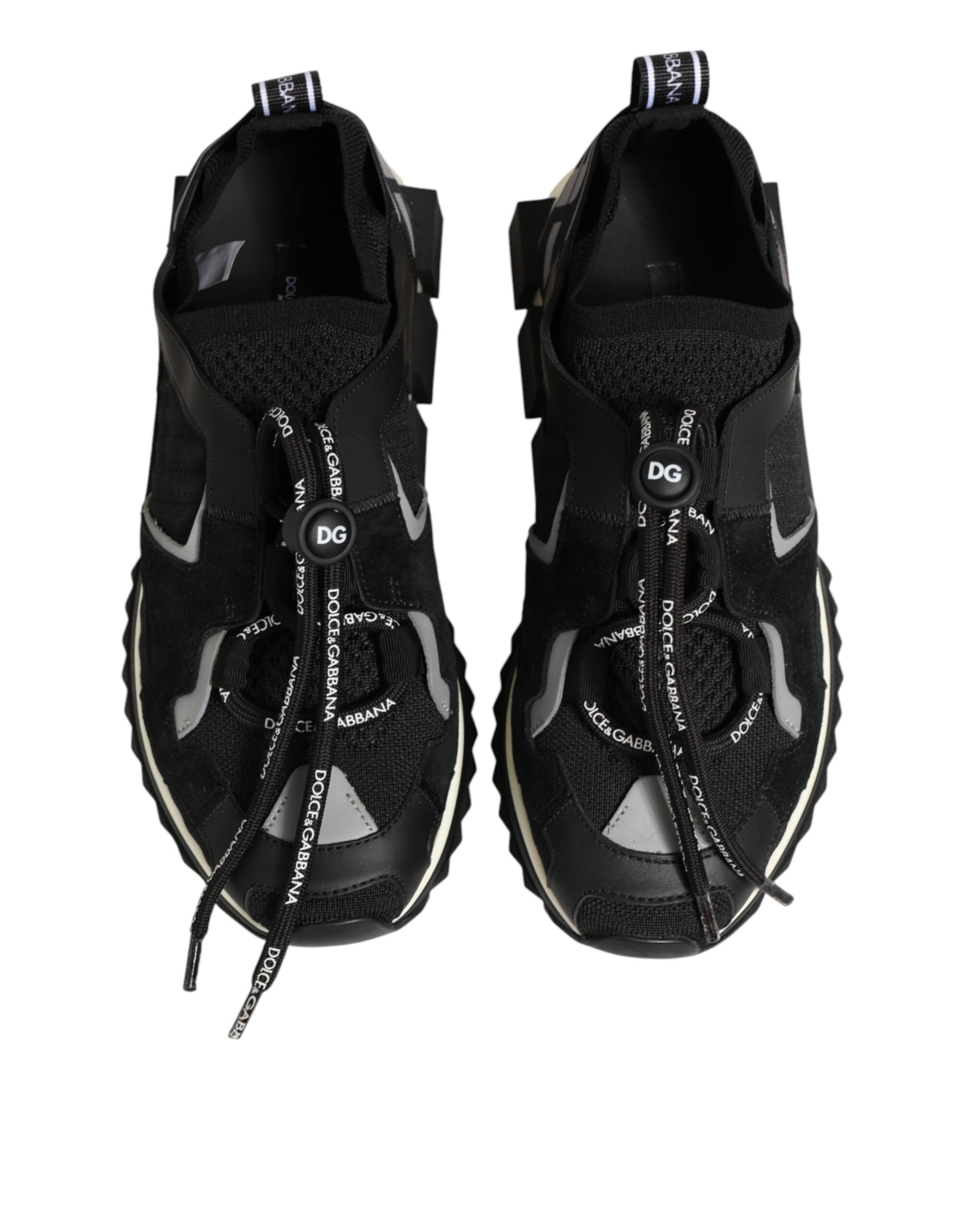 Pair of black athletic shoes with white laces and soles