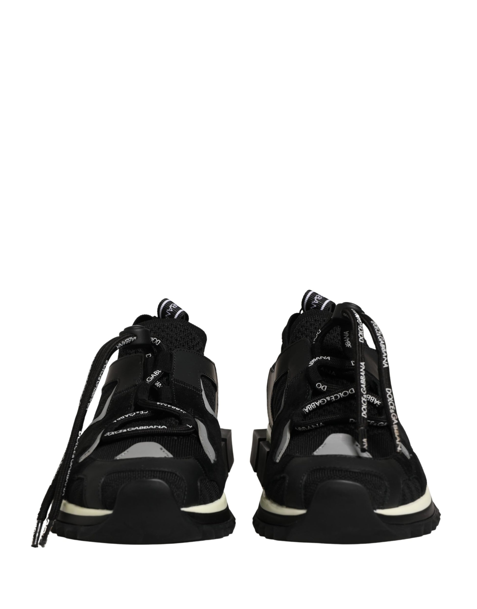 Pair of black mesh sneakers with white soles, featuring a lace-up design and brand logo on the side