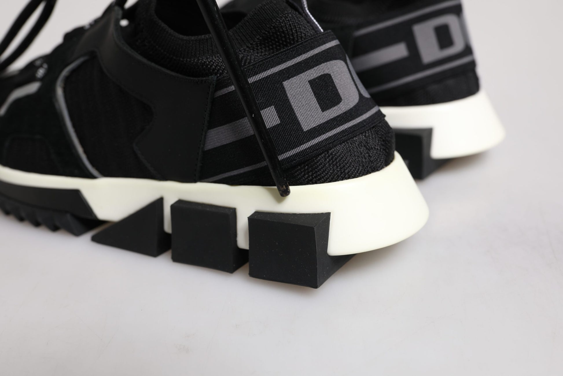 Black and white sneakers with a chunky sole