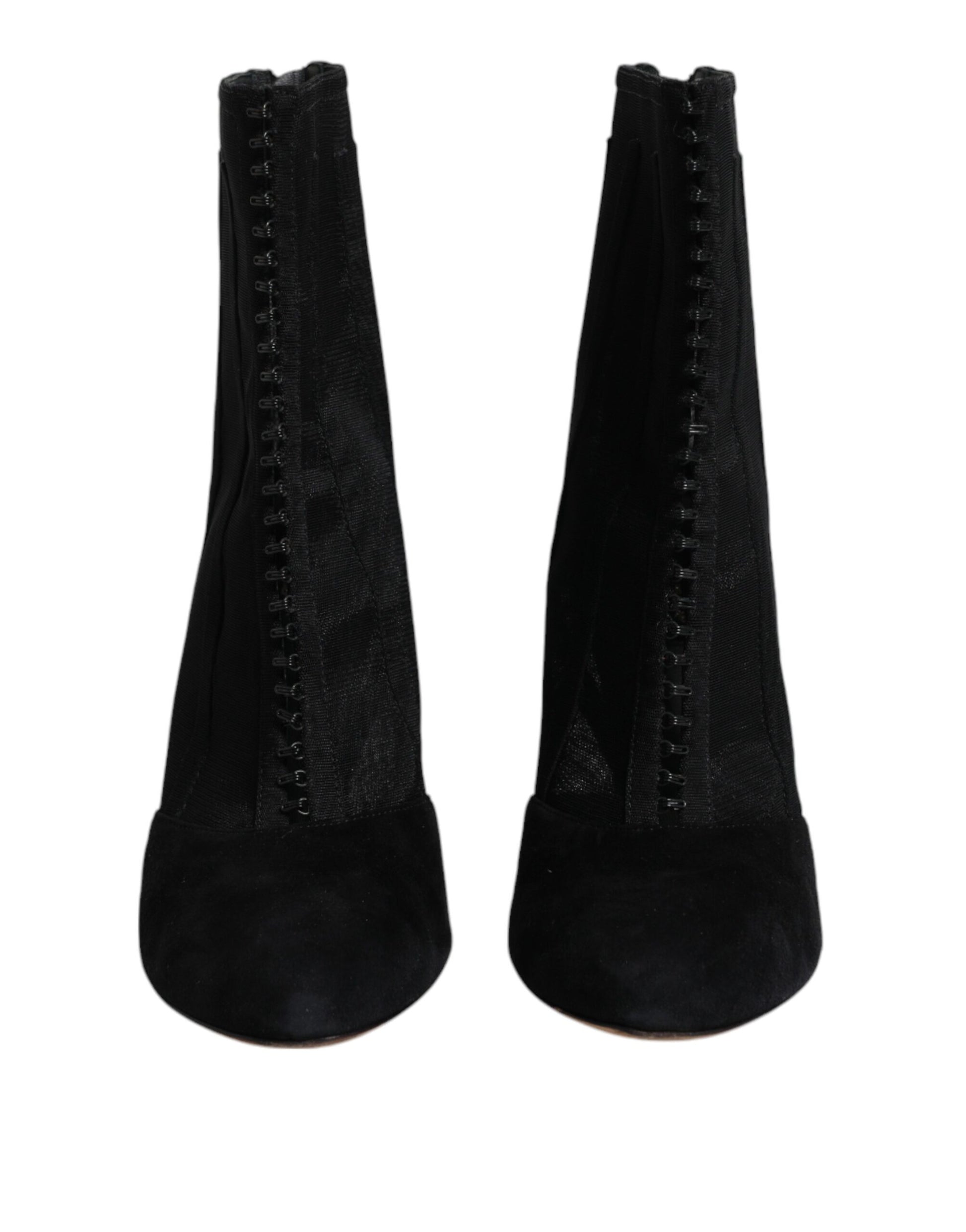 Pair of black knee high boots with zippers on sides