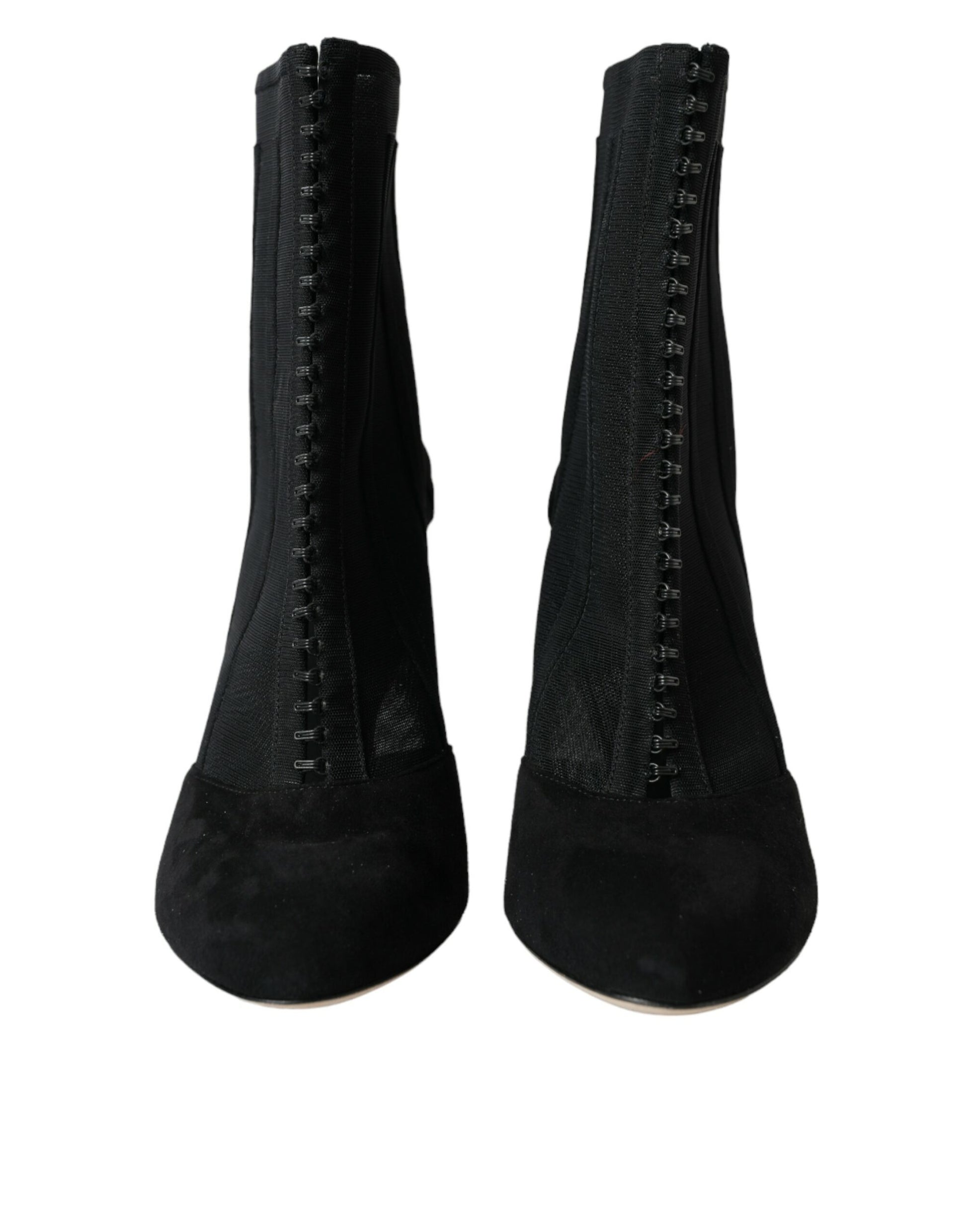Pair of black knee high boots with lace up front and side zippers