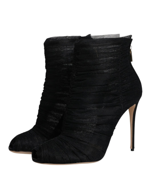 Black high heel boots with embellishments