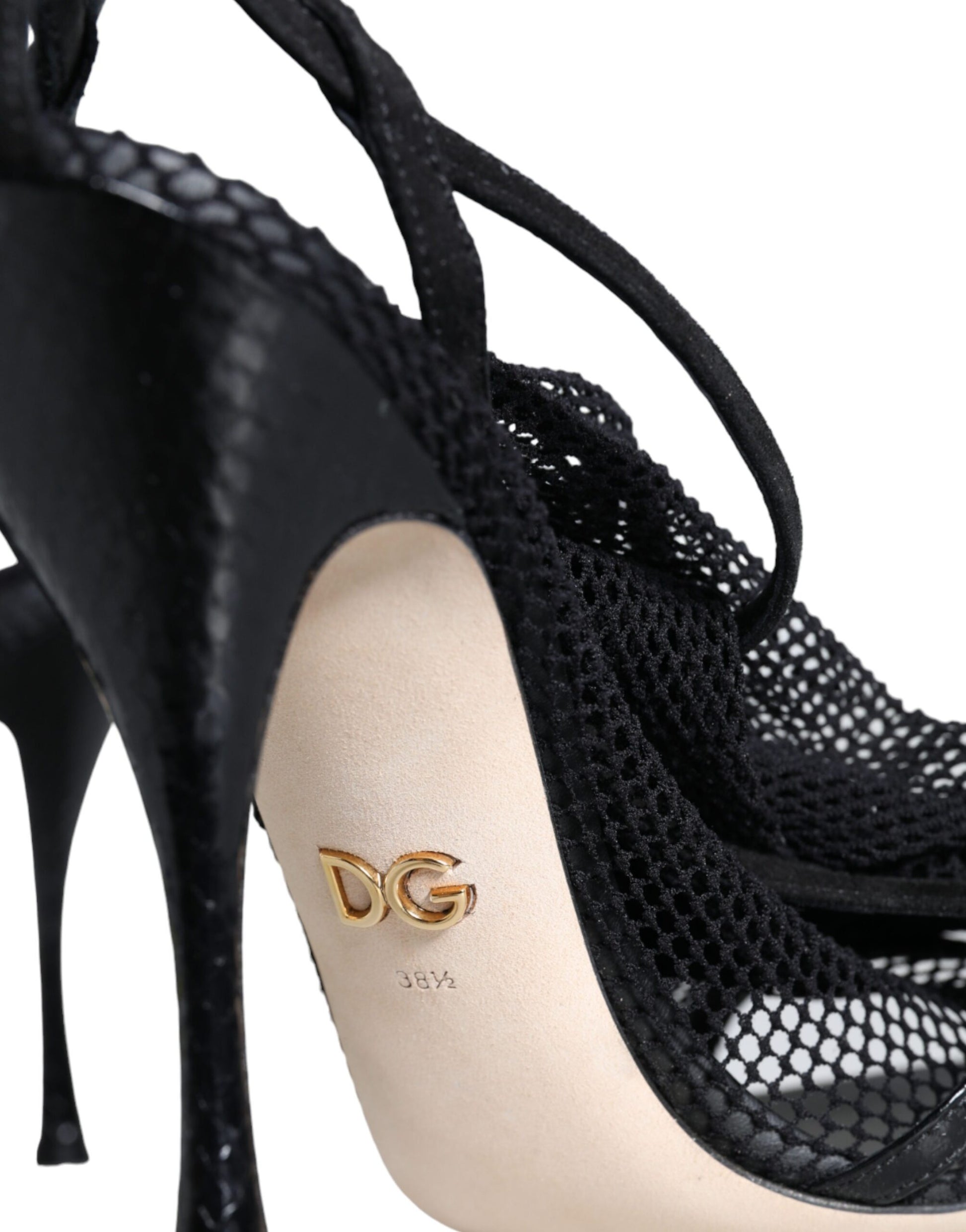 Black high heel shoe with gold logo on toe