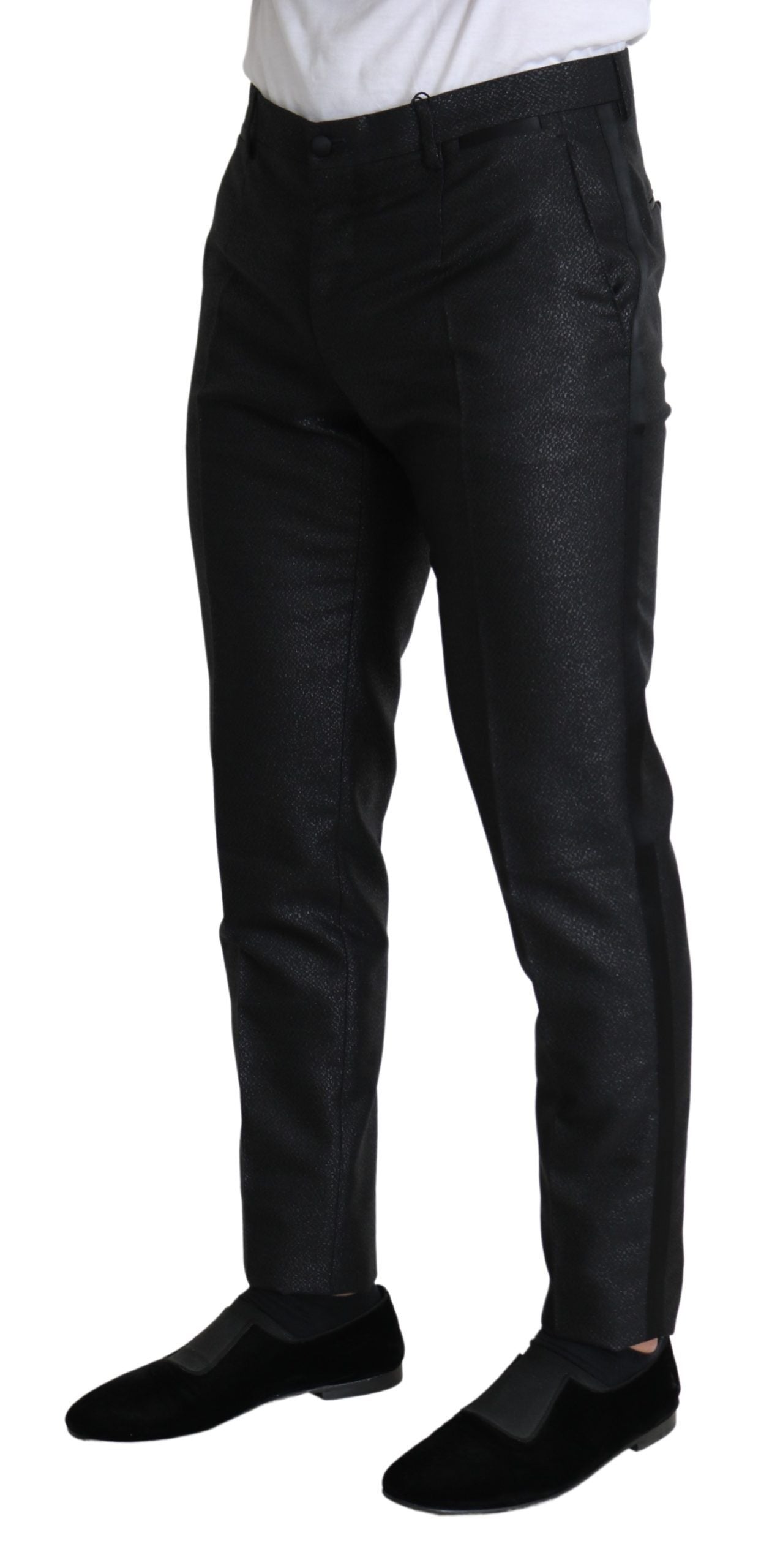 A pair of black metallic skinny trousers with a shiny finish, featuring a slim fit and a high waist