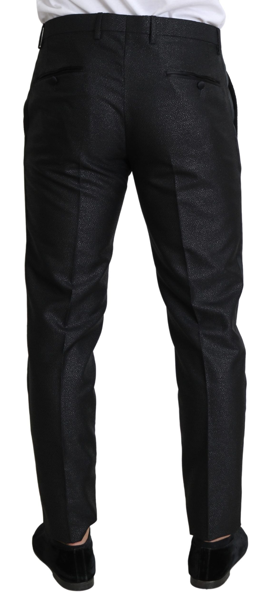 A pair of black metallic skinny trousers with a glittery texture