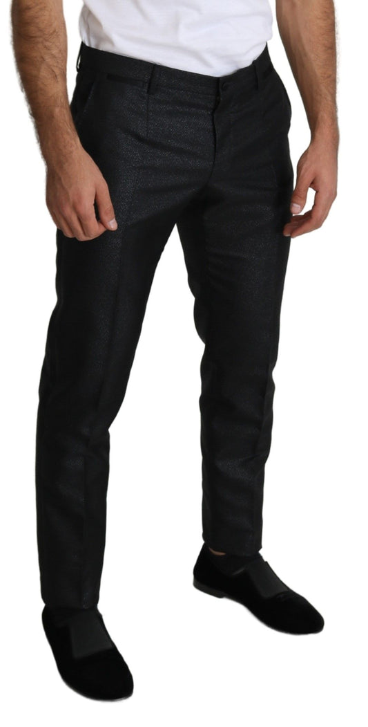 A pair of black metallic skinny trousers with a shiny finish, featuring a slim fit and a high waist