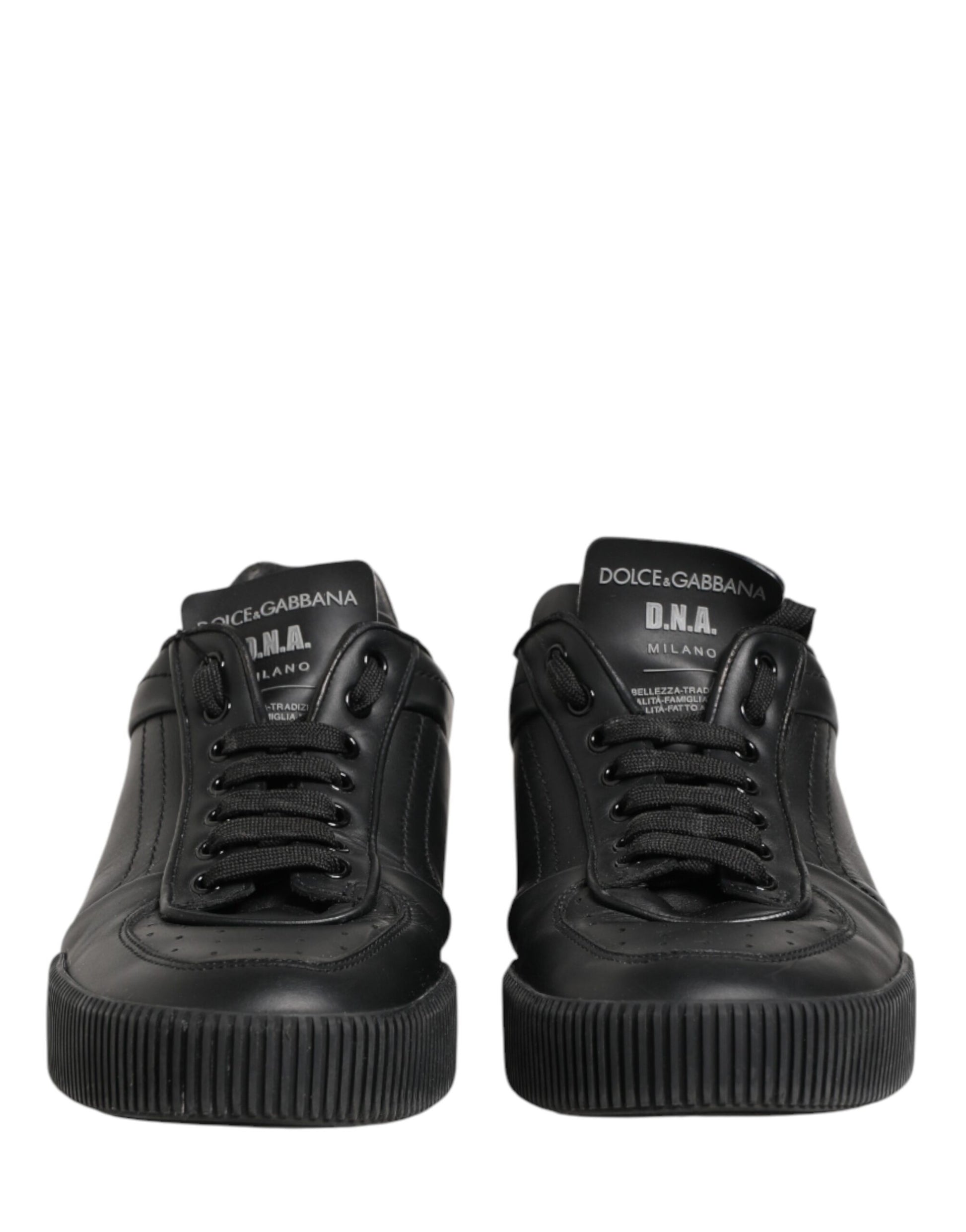 Pair of black high top sneakers with white soles