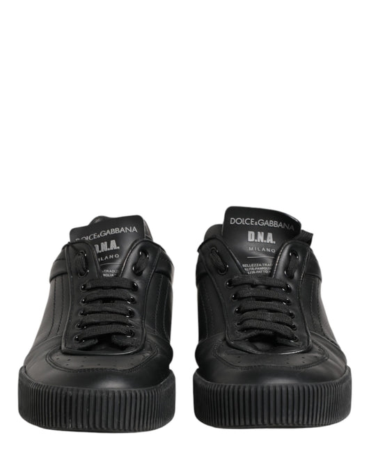 Pair of black high top sneakers with white soles