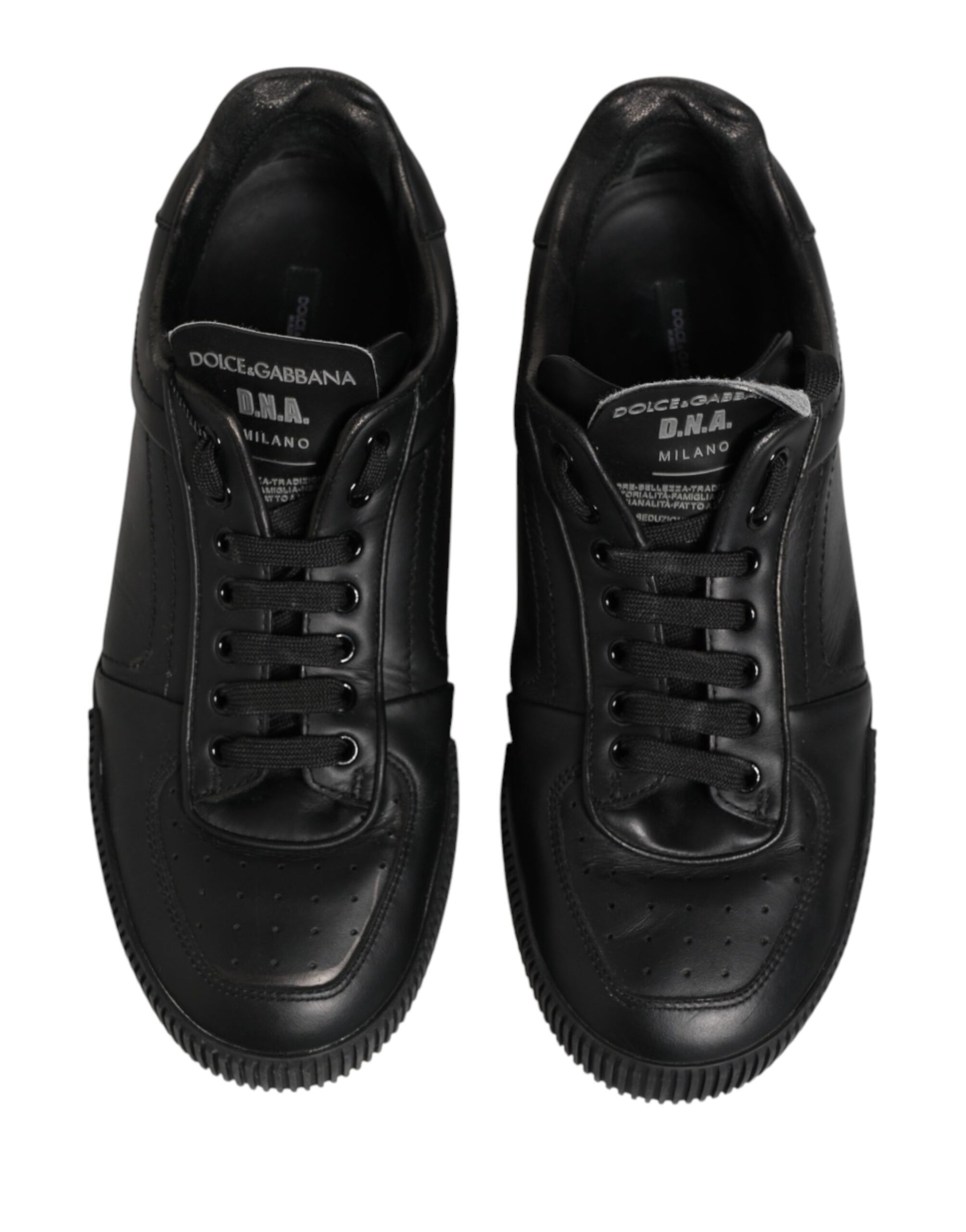 Pair of black sneakers with white soles