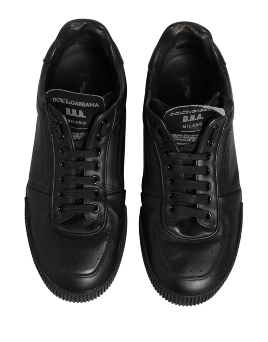 Pair of black sneakers with white soles