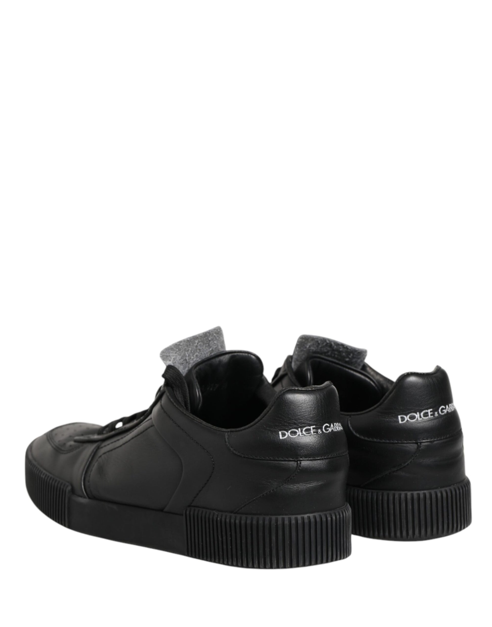 Pair of black sneakers with white soles