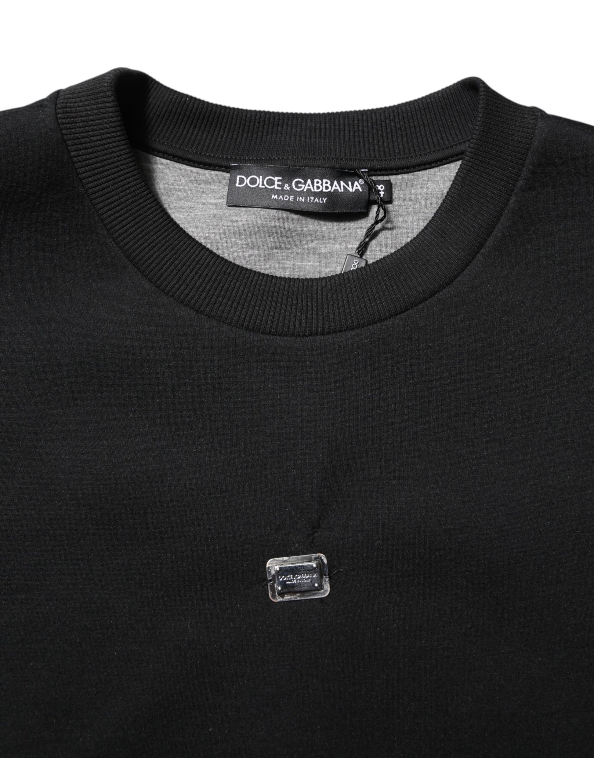 Black sweater with a logo on the left chest area