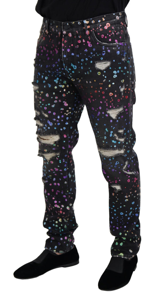 Pair of galaxy print pants with distressed areas